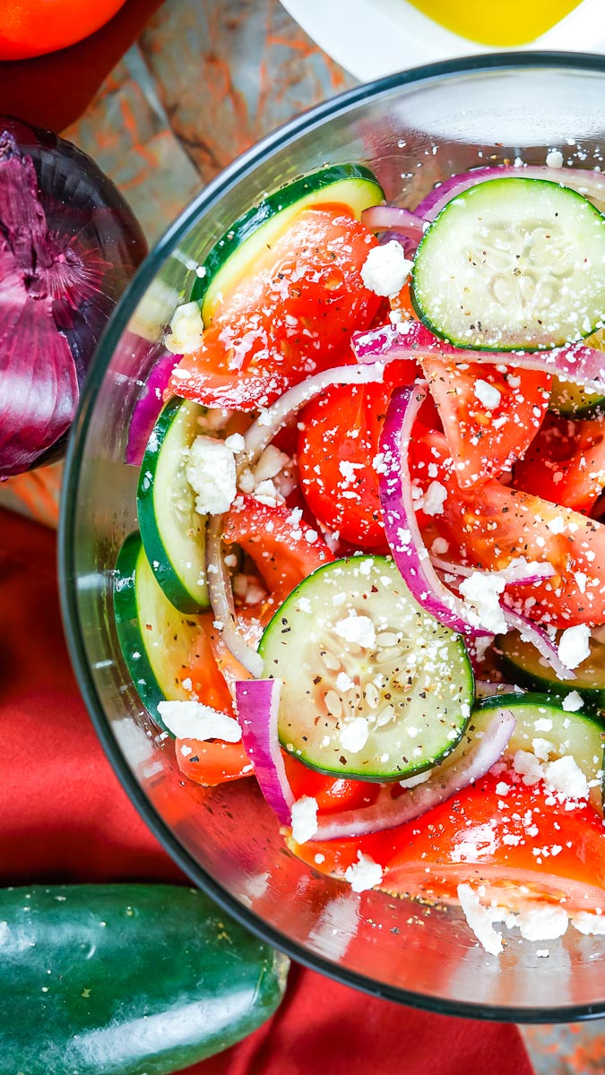 Cucumber and Tomato Salad in a clear glass serving bowl.