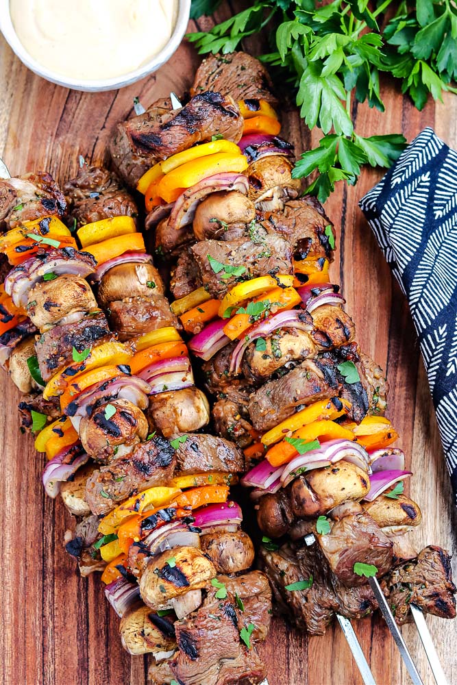 An overhead picture of the finished Grilled Steak Kabobs on metal skewers.
