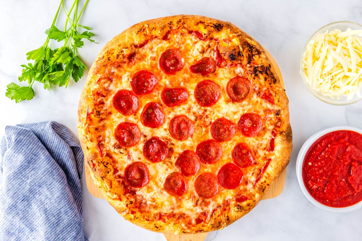 The finished homemade pizza on a counter.