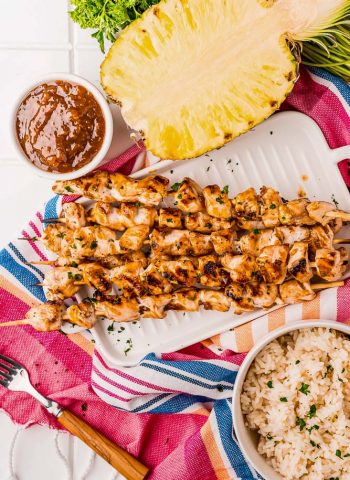 An overhead picture of the finished Grilled Chicken Skewers on a white platter.