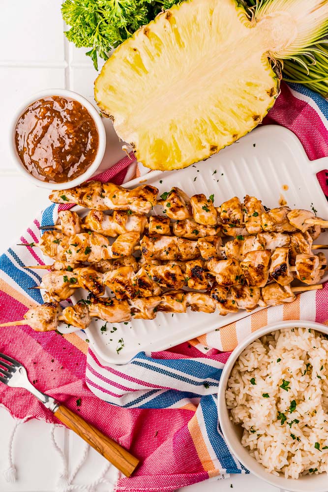 An overhead picture of the finished Grilled Chicken Skewers on a white platter. 