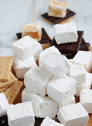 Homemade marshmallows stacked on top of each other.