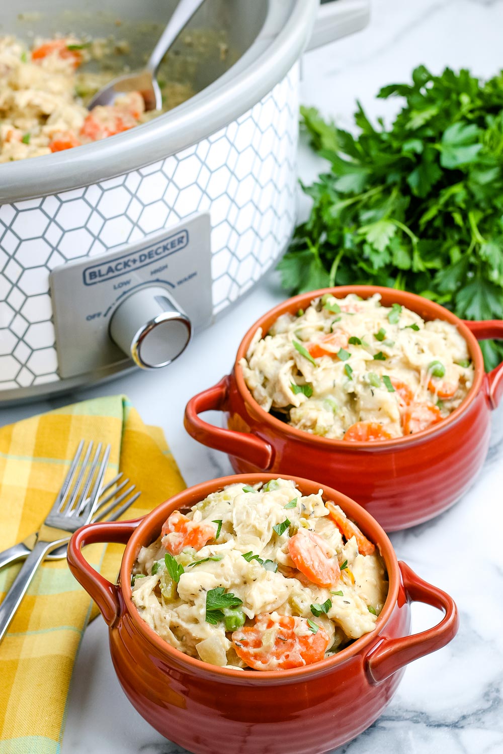 Two bowls full of this Crockpot Chicken and Dumplings recipe.