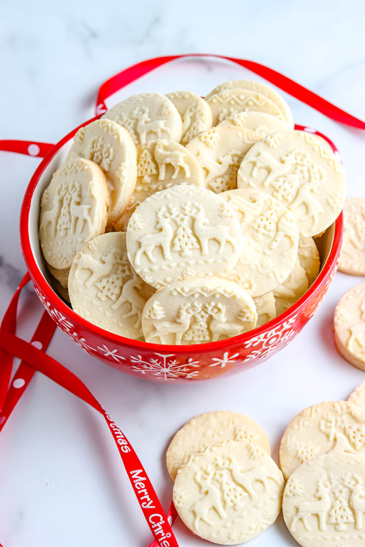 The finished Embossed Shortbread Cookies recipe in a red serving bowl.