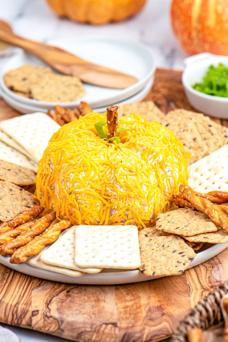 The finished Pumpkin Cheese Ball on a serving platter. 