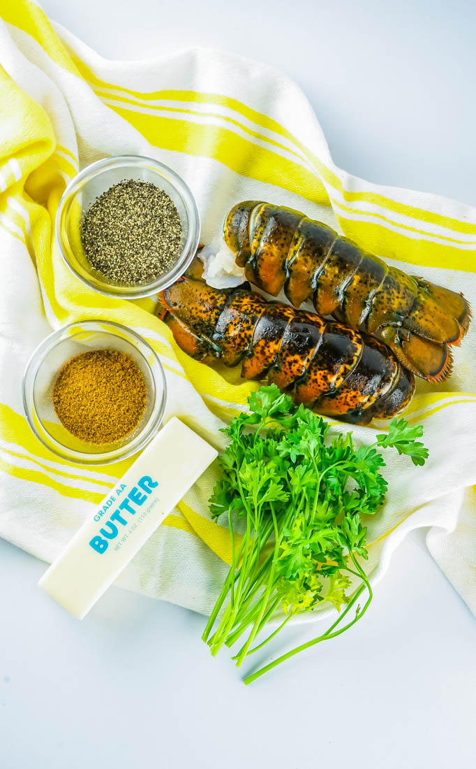 An overhead picture of all of the ingredients needed to make this Smoked Lobster Tails recipe.