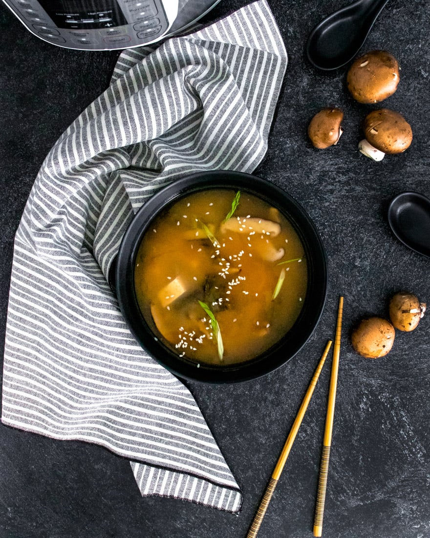 An over head picture of the finished  Instant Pot Miso Soup in a black bowl. 