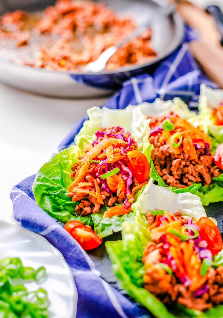 The finished Asian Ground Beef Lettuce Wraps on a blue napkin.