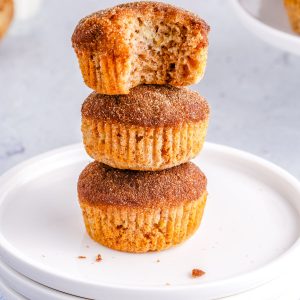 A close up picture of the finished Banana Cinnamon Muffins stacked on top of each other.