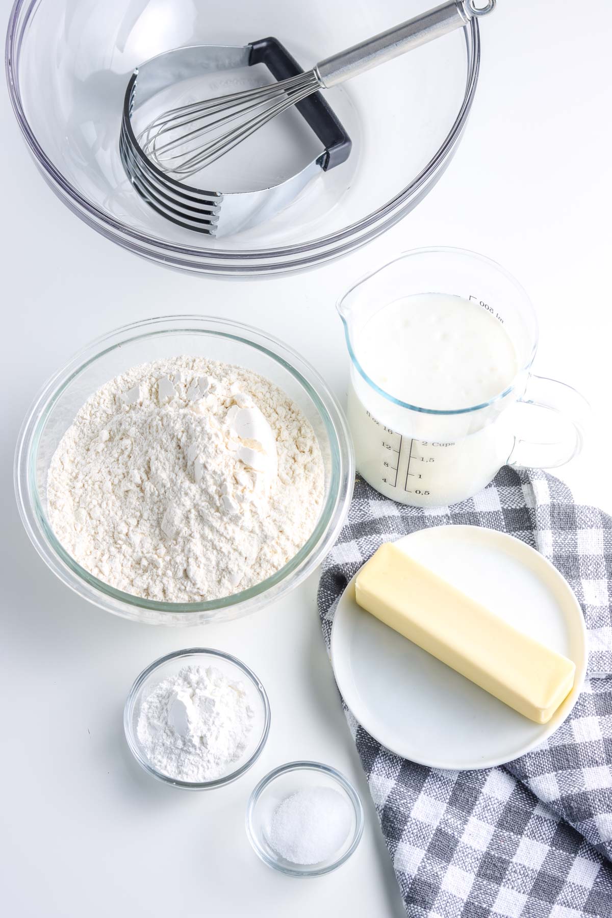 An overhead picture of all of the ingredients needed to make this buttermilk biscuit recipe.