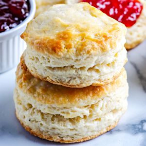 Two Old Fashioned Buttermilk Biscuits stacked on top of each other.