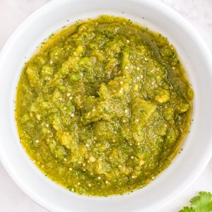 A close up picture of the finished Salsa Verde in a white serving bowl.