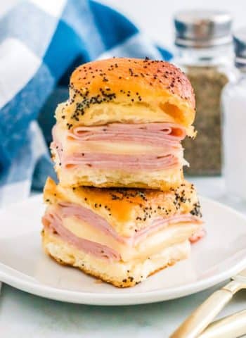 Hawaiian Ham and Cheese Sliders stacked on top of each other.