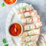 The finished Vietnamese Summer Rolls on a white serving platter.