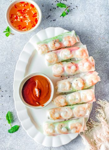 The finished Vietnamese Summer Rolls on a white serving platter.