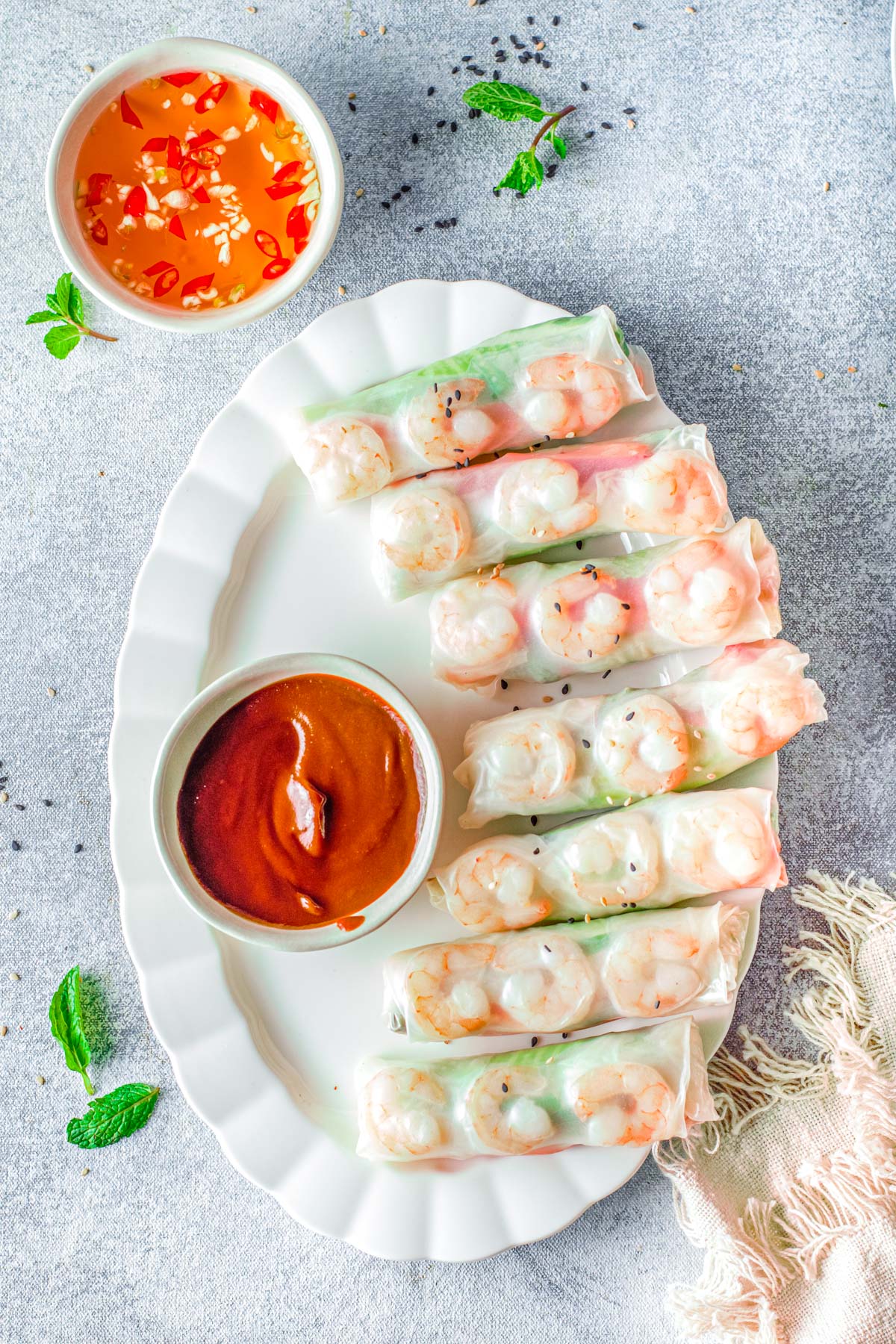 The finished Vietnamese Summer Rolls on a white serving platter. 