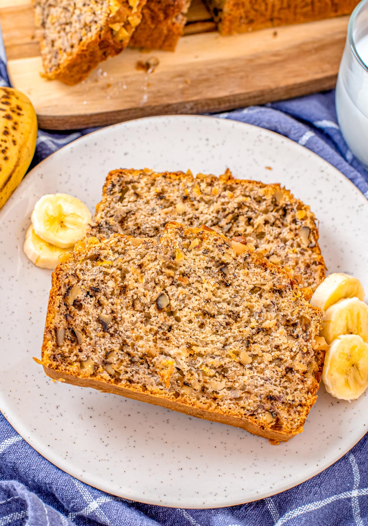 An overhead picture of two slices of High Altitude Banana Bread recipe on a plate.