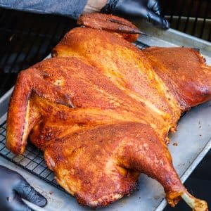 A close up picture of the finished turkey right when it's been taken off of the smoker.