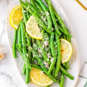 The finished Air Fryer Green Beans recipe on a white platter.