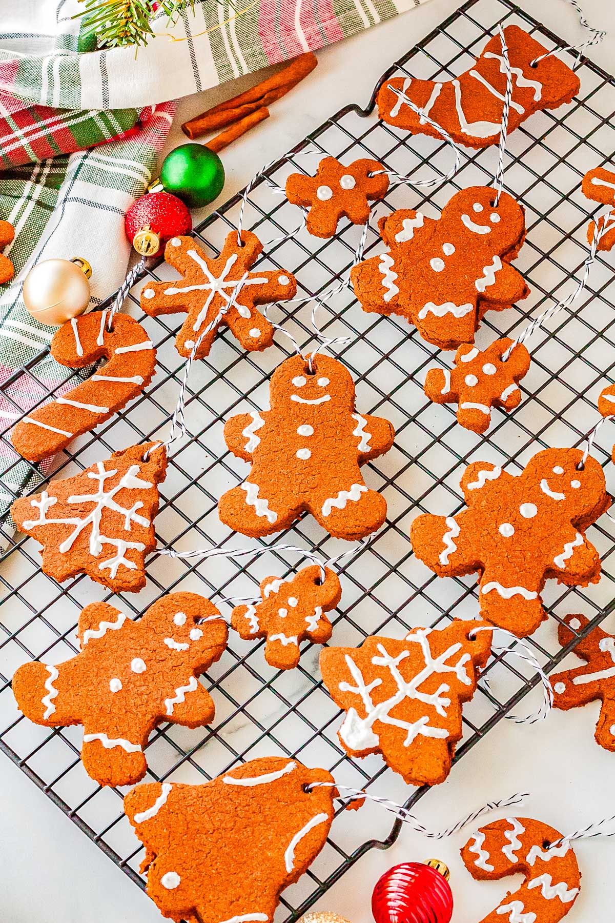 Applesauce and cinnamon ornaments on a wire rack.
