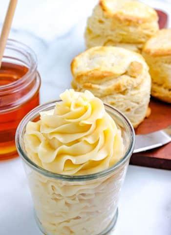 The finished Whipped Honey Butter pipped into a glass jar.