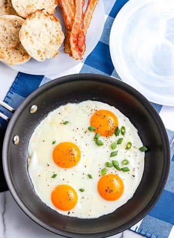 An overhead picture of the finished Sunny Side Up Eggs in a skillet.