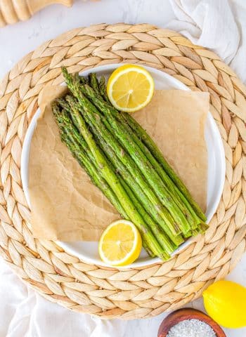 An overhead picture of Air Fryer Asparagus on a white platter.