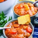 The Meatball Stew in blue bowls with cornbread.
