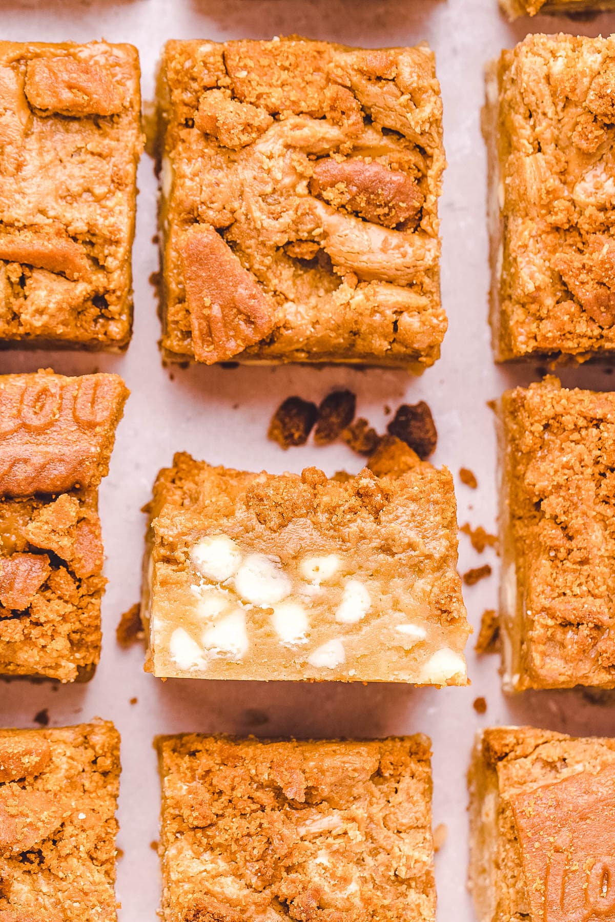 The cut Biscoff Blondies with one turned over so you can se how gooey they are on the inside.