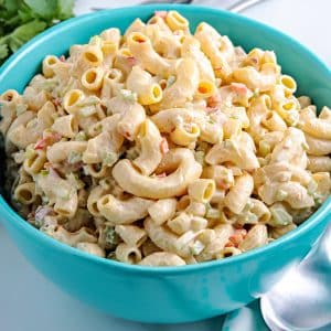 A close up picture of the finished Deli Macaroni Salad Recipe in a blue serving bowl.