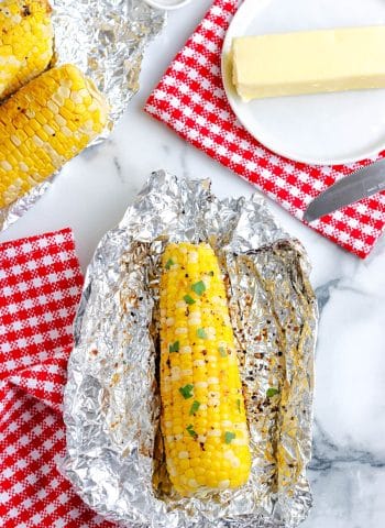 An overhead picture of the finished Grilled Corn On The Cob In Foil.