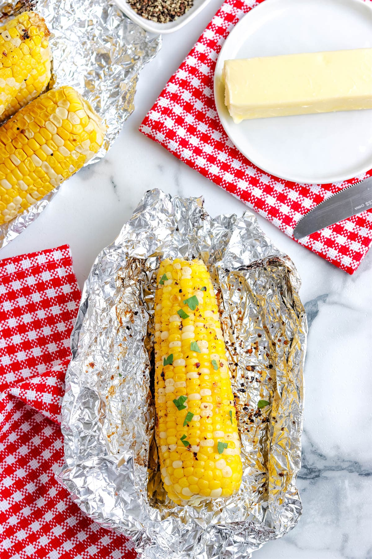 An overhead picture of the finished Grilled Corn On The Cob In Foil. 