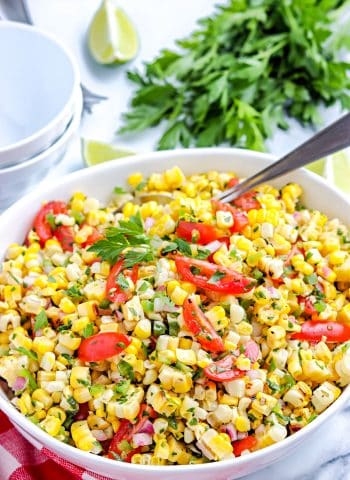 The finished Grilled Corn Salad in a white serving bowl.