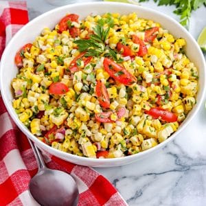 The finished Grilled Corn Salad recipe in a white serving bowl.