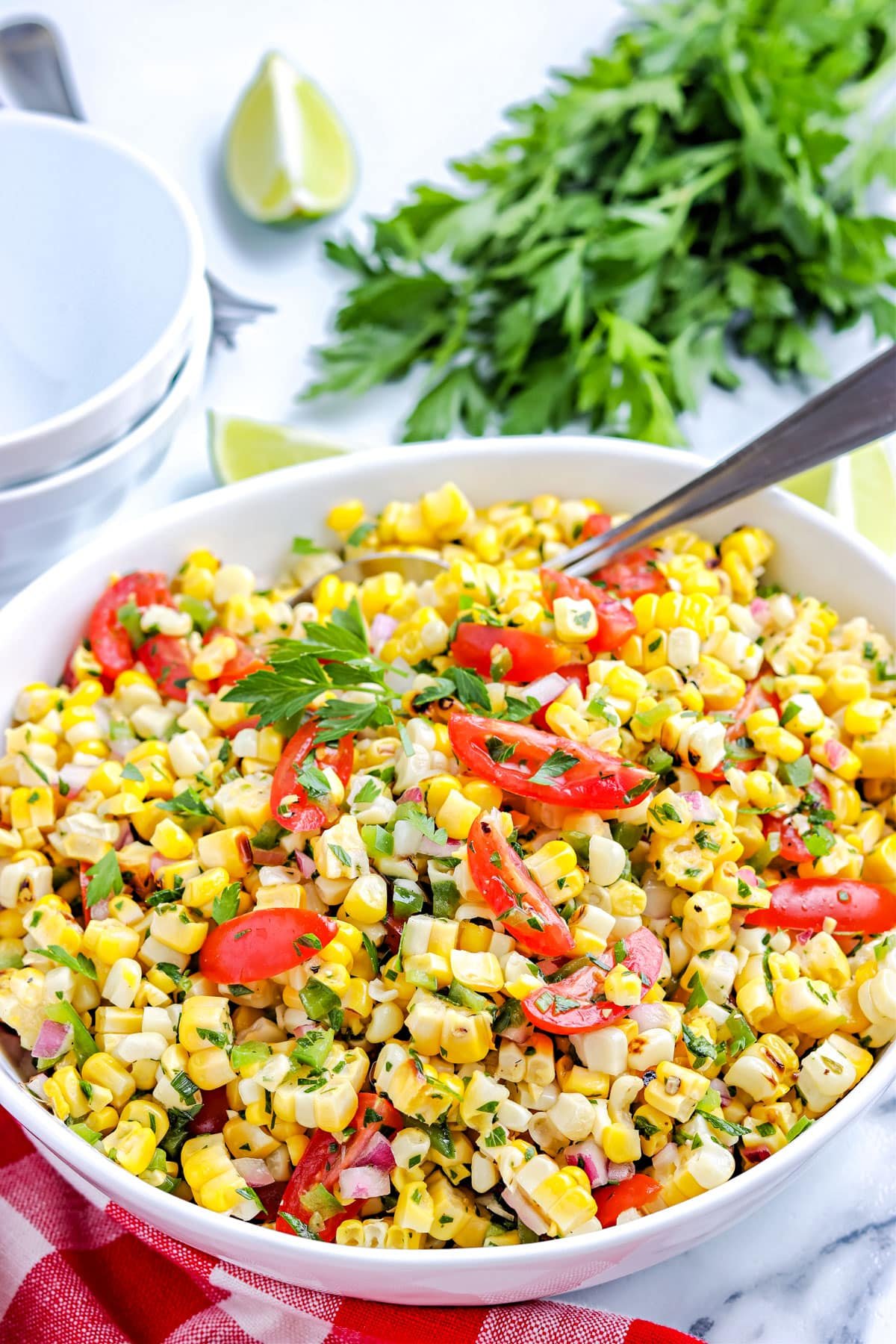 The finished Grilled Corn Salad in a white serving bowl. 