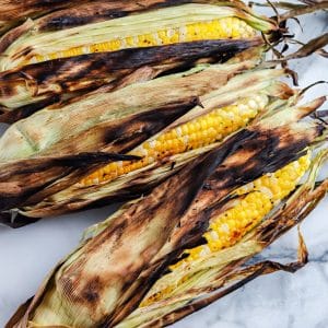Grill Corn In Husk on a platter.