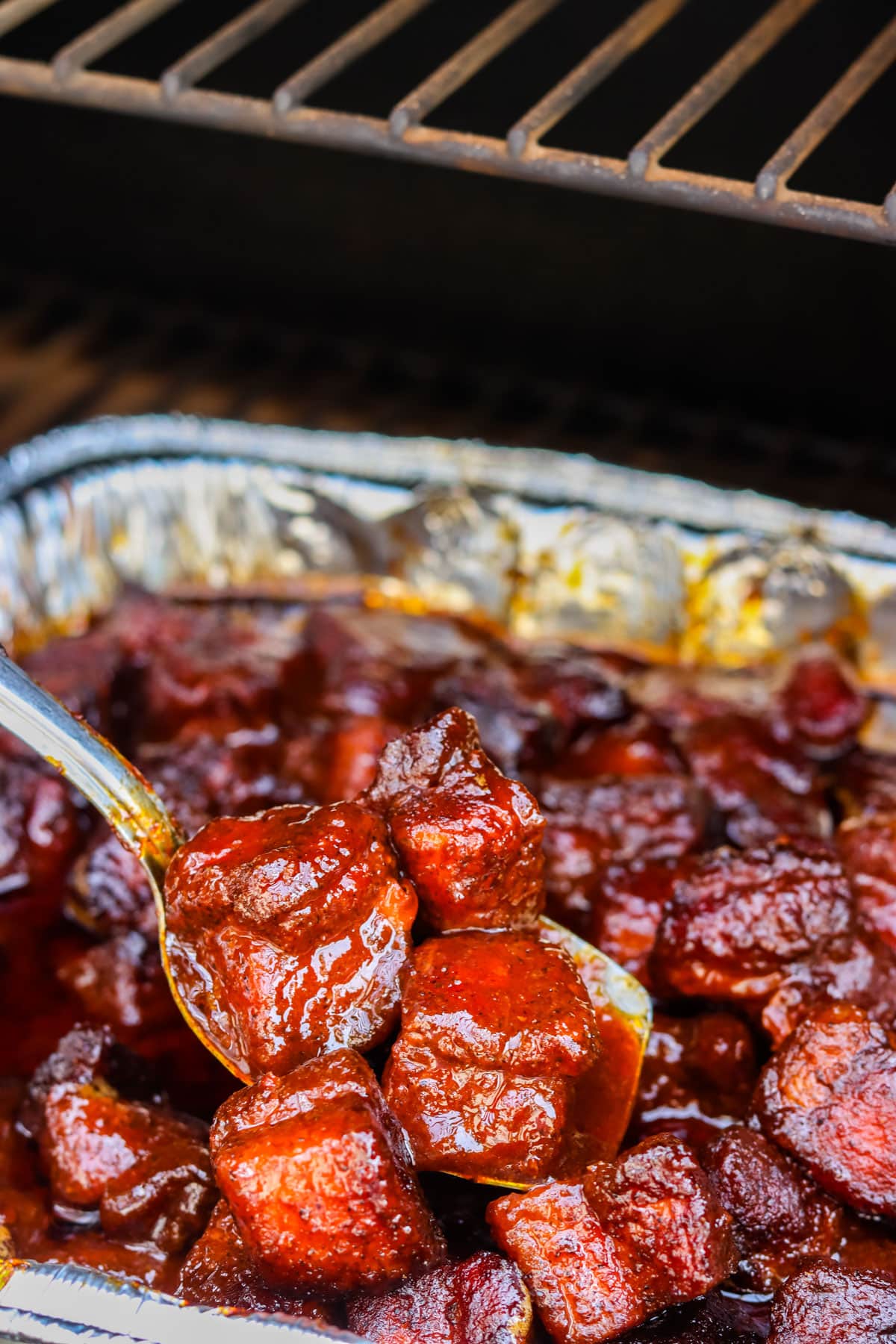 The finished Pork Belly Burnt Ends in a foil pan. 