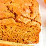 A close up picture of slices of Pumpkin Banana Bread so you can se small chunks of banana.