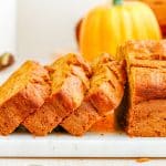 Three slices of Pumpkin Banana Bread stacked on each other.