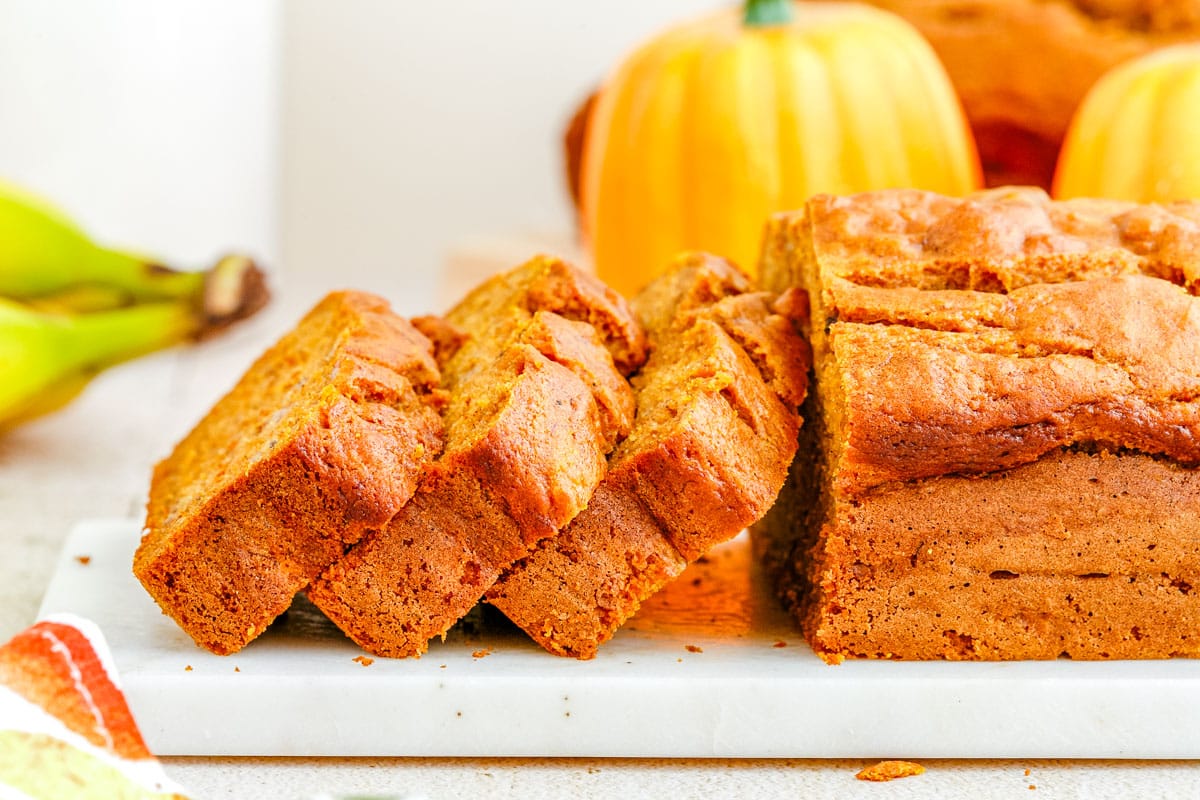 Three slices of Pumpkin Banana Bread stacked on each other.