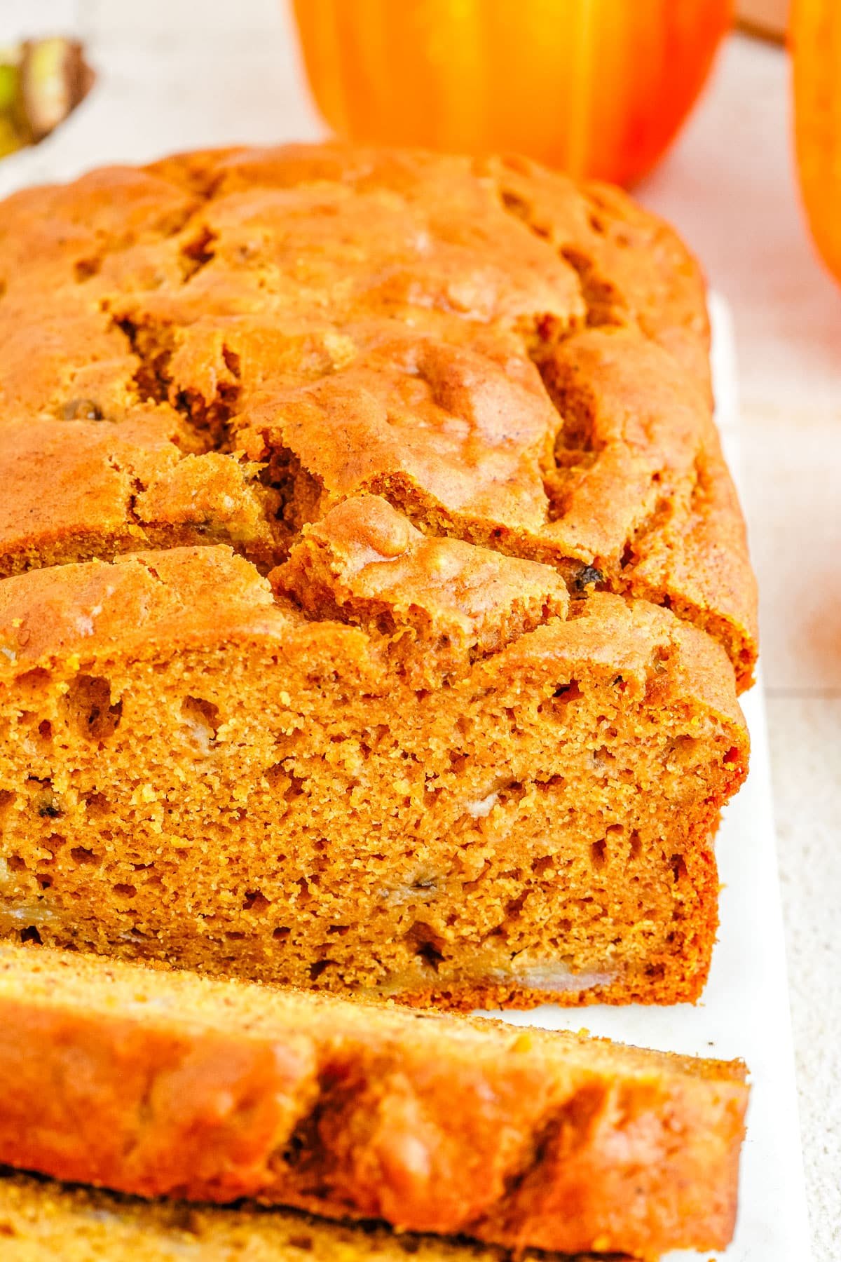 A close up picture of slices of Pumpkin Banana Bread so you can se small chunks of banana. 