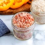 A close up of the finished Smoked Salt in a glass jar.