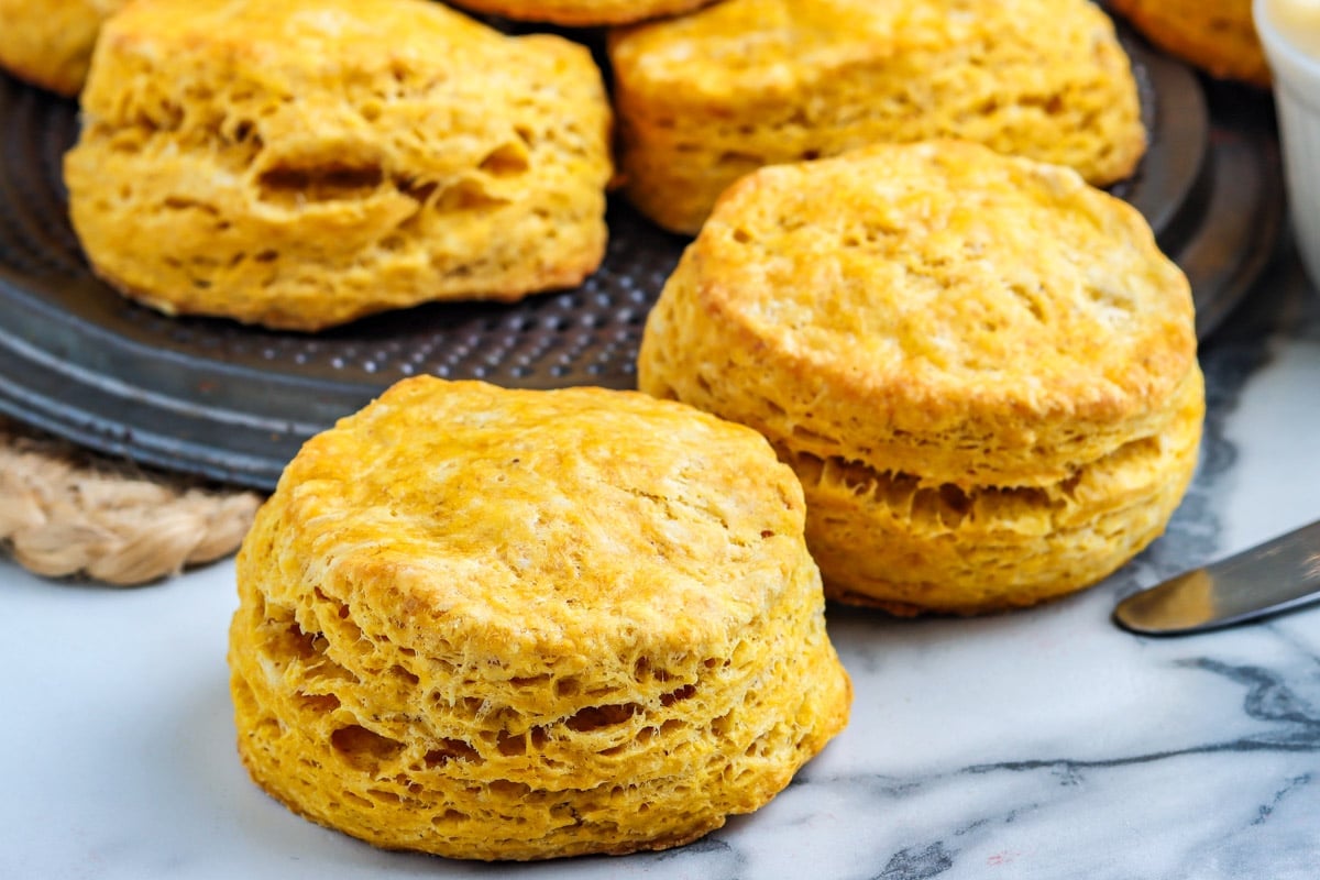 Biscuits made of pumpkin on a countertop.