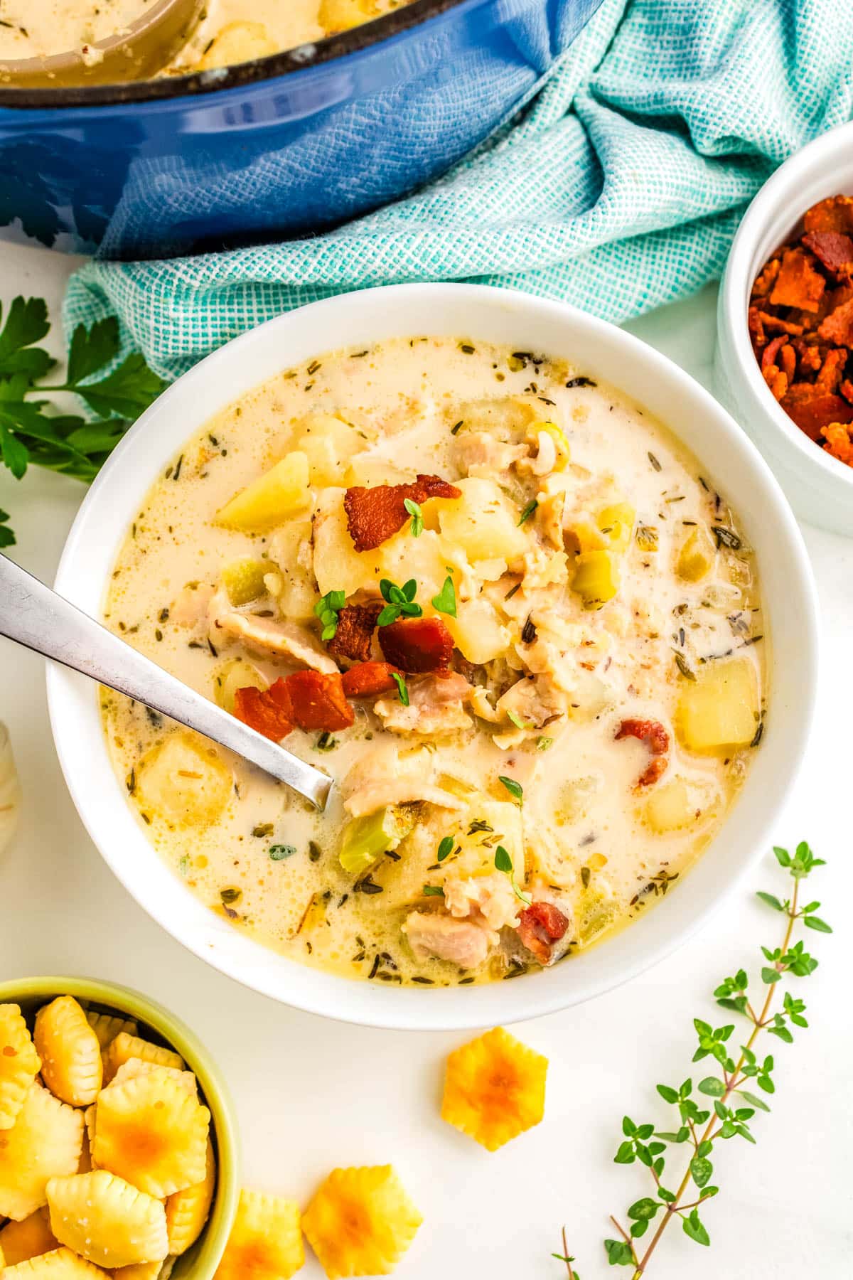 Chowder in a bowl that's garnished with bacon.