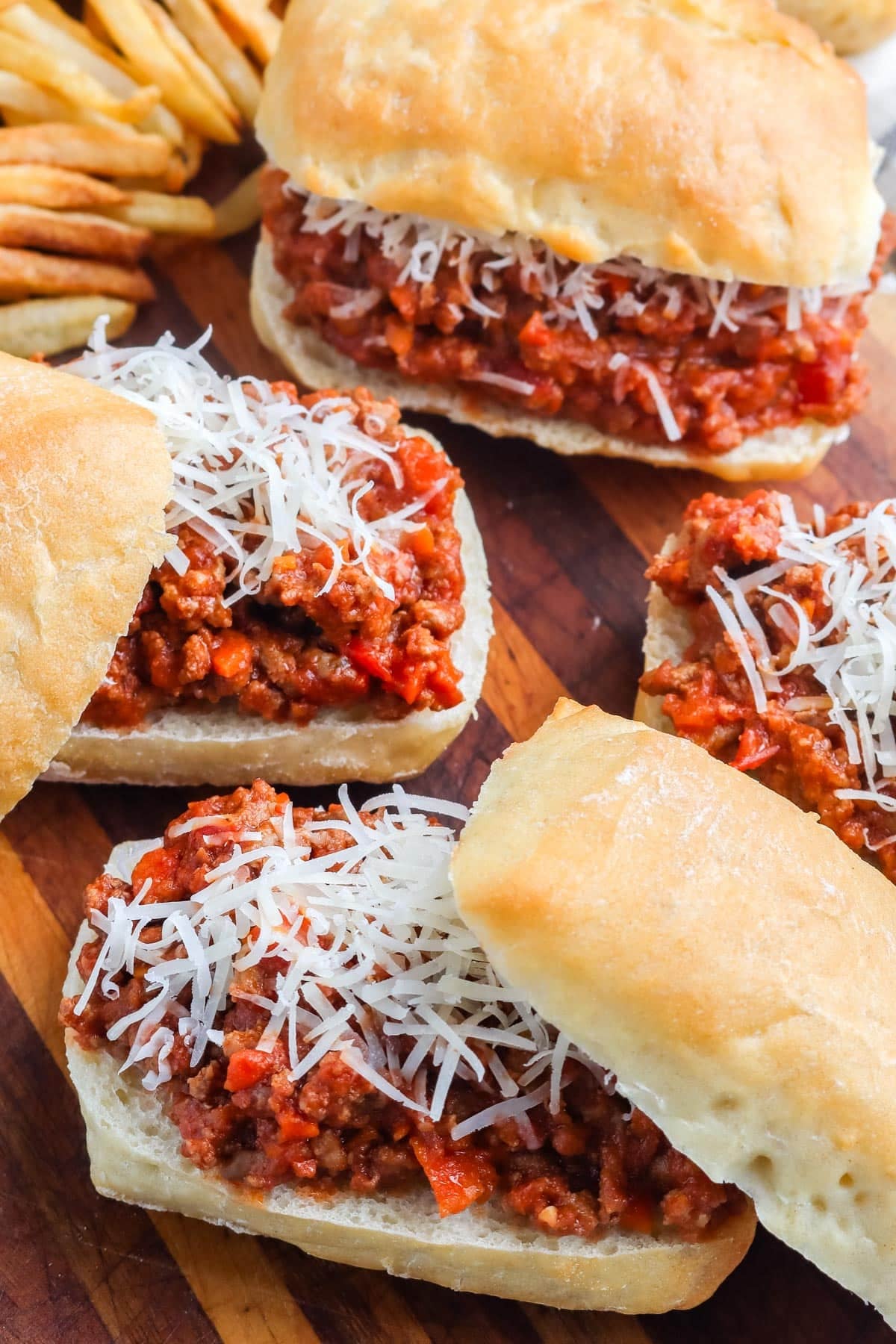 Italian sloppy Joes on a wooden cutting board.