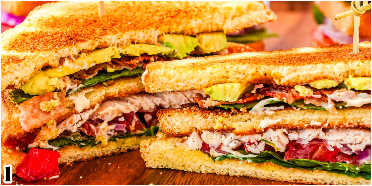 The finished sandwich cut in hald and on a cutting board.