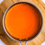 Homemade Buffalo sauce in a saucepan.