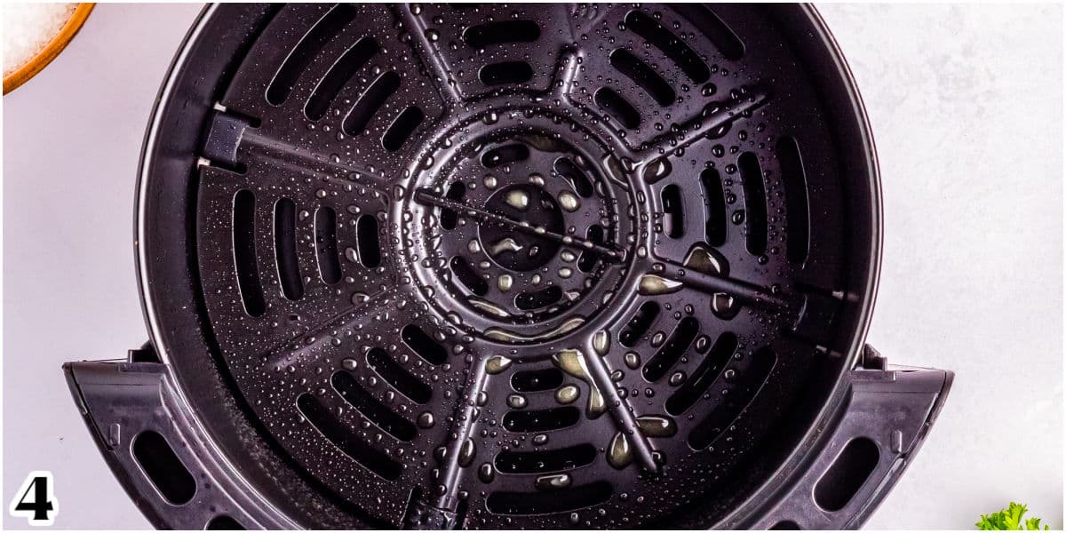 An air fryer basket sprayedwith cooking spray.