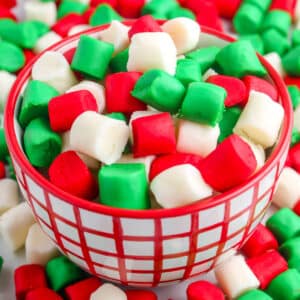 Butter mints in a red and white candy dish.