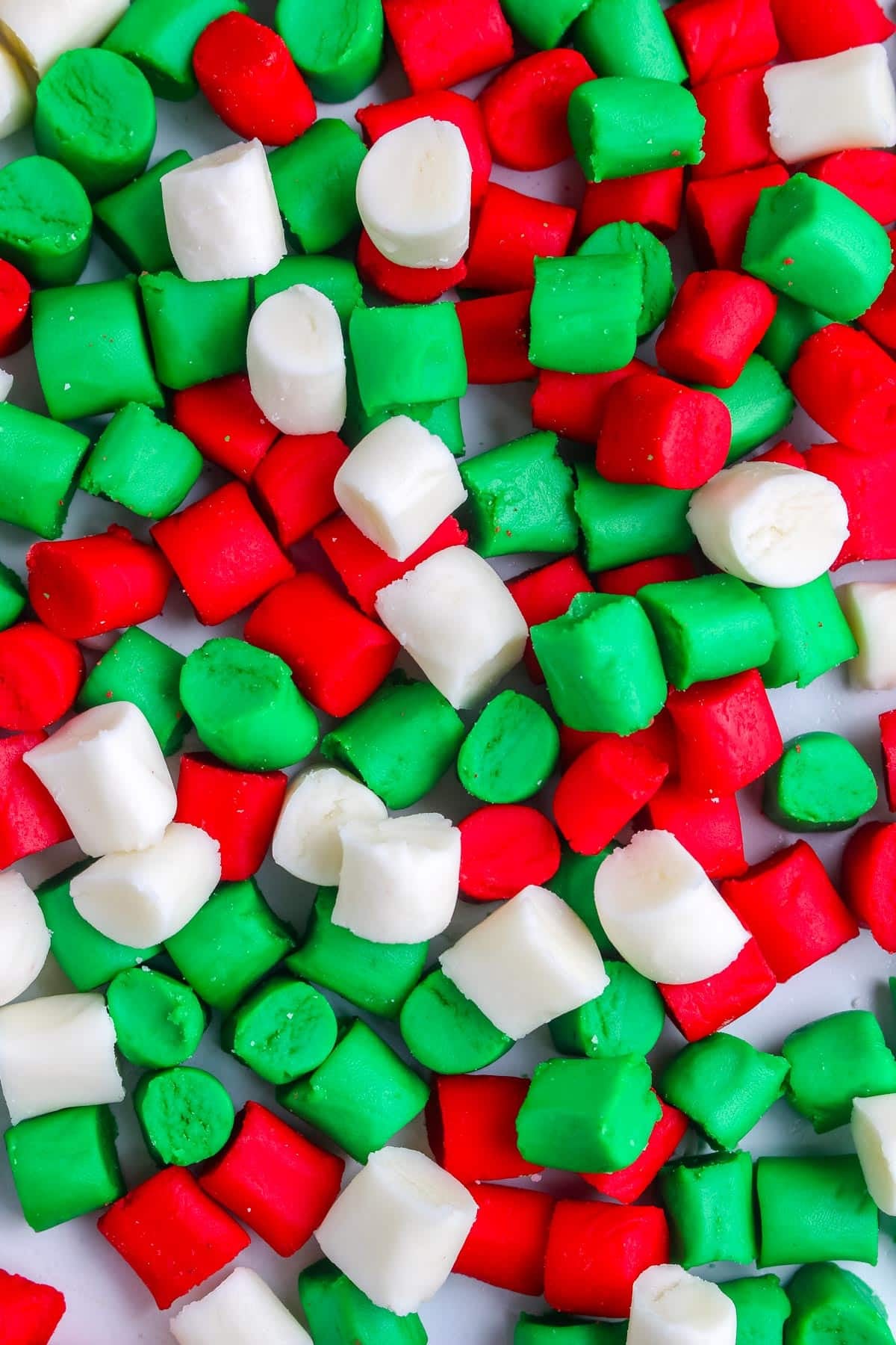 Homemade butter mints colored red, green, and white.